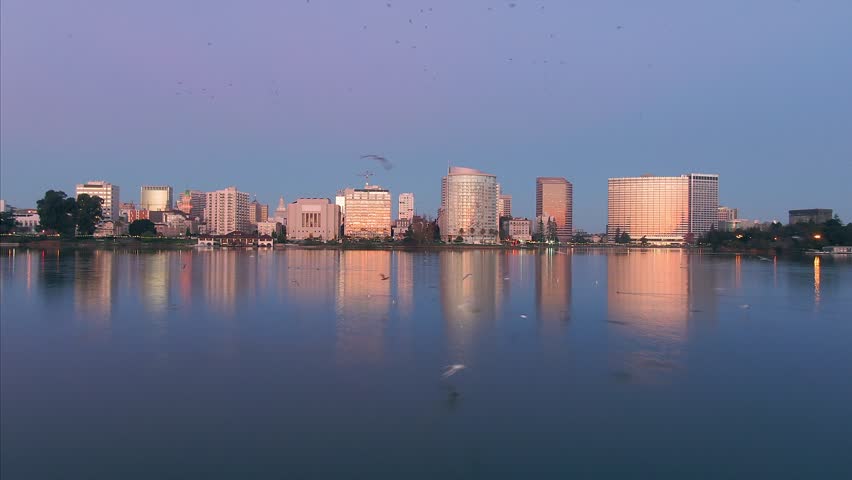 Aerial Shot Of Oakland City Skyline and Lake Merritt At Sunrise