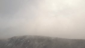Clouds and mist covering  mountain ranges 4K aerial footage