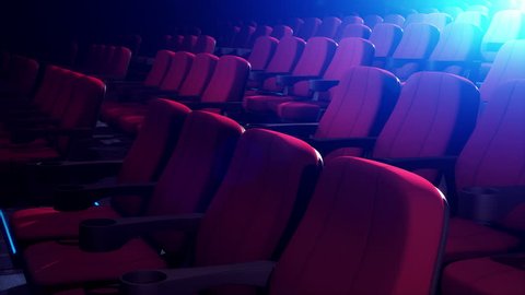 Rows Of Comfortable Red Chairs In Dark Cinema Theater. Empty Cinema Seats in Theatre for Movies. Seamless Loop.