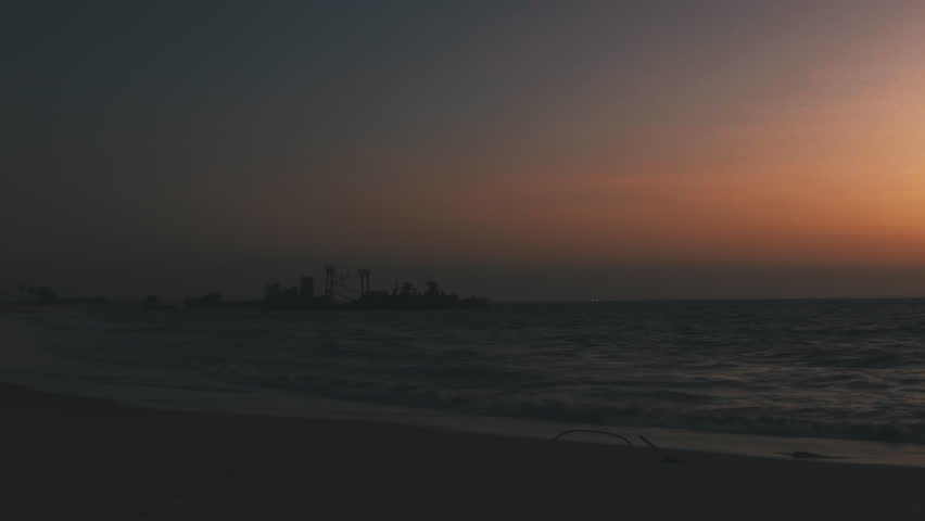 Dramatic sunset on the Cemetery beach of ships with wrecked ships. Luanda. Angola. Africa.