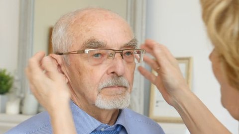 Older Couple Older Wife Helps Put Stock Footage Video (100% Royalty