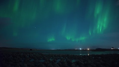Realtime Aurora borealis over swans in lake, Grotta Iceland.mov

