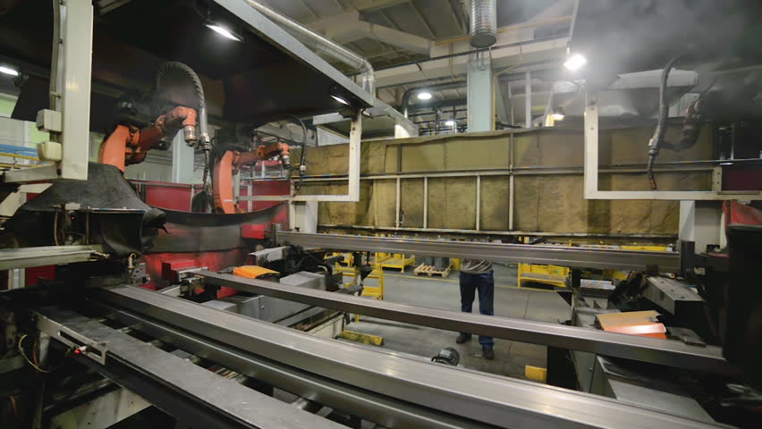 Welding robot, welds metal beams. Modern welding production | Shutterstock HD Video #1022089123