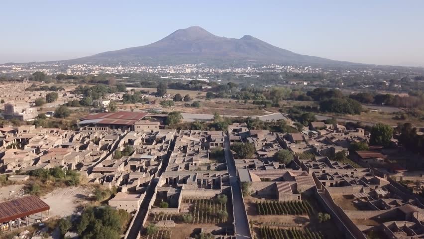 The ruins of Pompeii overshadow by Mount Vesuvius Royalty-Free Stock Footage #1022090323