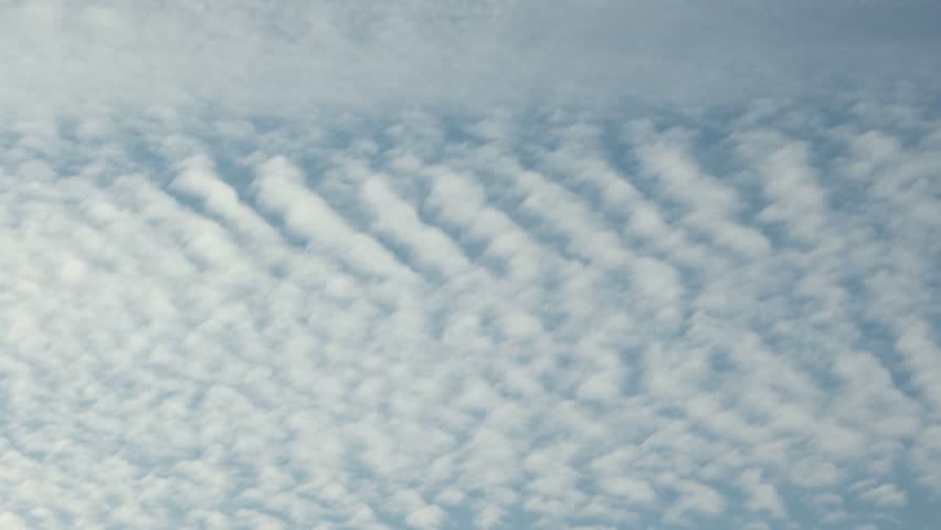 Cirrocumulus on blue sky, background, slow motion