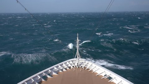 View down at the rough seas during a windy storm on a modern cruise ship in the ocean