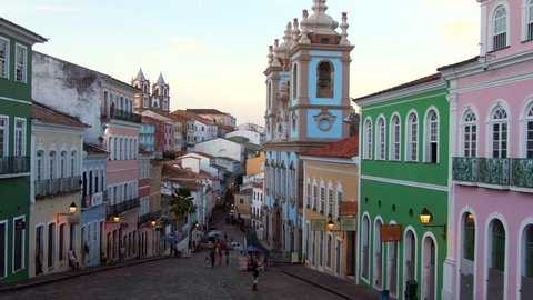 Salvador da Bahia, Brazil, aerial view of the historical district of Pelourinho showing colourful colonial buildings at twilight. Dolly right. 