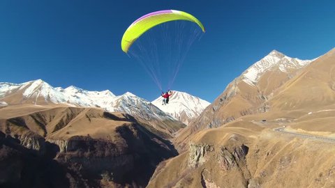 Paragliding - Caucasus Mountains, Friendship Monument, Caucasia, Gudauri, Georgia, Europe / Asia.