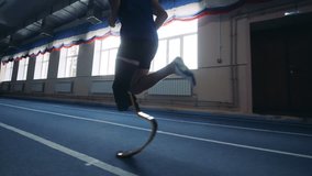 One man running with prosthetic leg, side view. - Powered by Shutterstock - Get 15% off with code: PIKWIZARD15