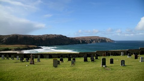 Lawn cemetery overlooking the ocean on the Isle of Lewis