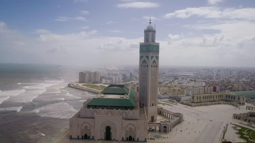 The Hassan II Mosque or Grande Mosquée Hassan II is a mosque in Casablanca, Morocco. It is the largest mosque in Africa, and the 5th largest in the world. Royalty-Free Stock Footage #1022132605