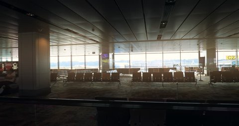 SINGAPORE, SINGAPORE circa 2020: Empty departure and arrival halls of international airport during Covid-19 virus outbreak. Airlines and tourism industry crisis concept background