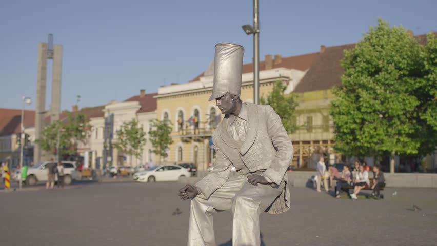 Famous Art - theatre company Romania / Bronze living statue in a city square.