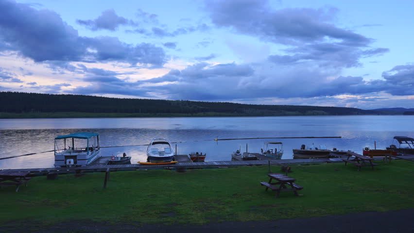 Time lapse of a lake during sunset (Double layer clouds)