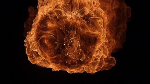 Fire ball explosion, high speed camera, isolated fire flame on black background, slow motion.