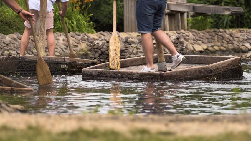 Youngsters rowing in a lake
