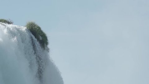 Tilt down on a waterfall in slowmotion