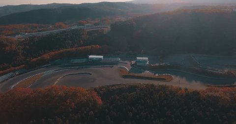 Beautiful Aerial Drone Shot of the Grand Stand a Race Track in the Mountains at Sunset.