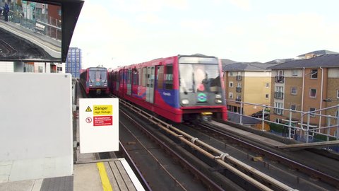 DLR, Dockland Light Railway commuter train departs from the station. December 2018, London, UK
