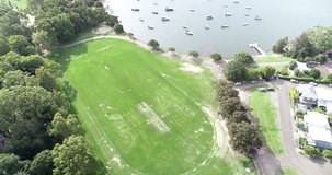 Drone footage of waterside park and boats on the water in Sydney, NSW, Australia