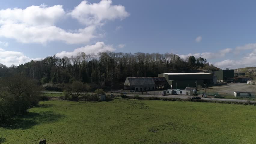Ballybeg Abbey ruins in Ireland, aerial 4k