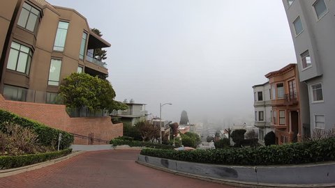San Francisco, CA - January 10, 2019: HD video driving POV down Lombard St,  famous for a steep, 1 block section with 8 hairpin turns. It is a major tourist attraction with hundreds of visitors a day.