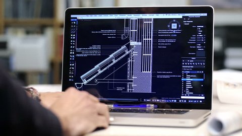 architect at work with a cad software with a laptop computer