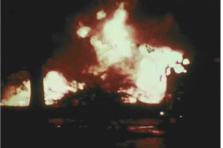 CIRCA 1974 - A hurricane hits a city at night and floods it