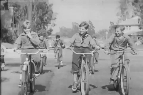 CIRCA 1950 - Different wheel and axle machines are demonstrated, such as a bicycle, car steering wheel, and pencil sharpener.