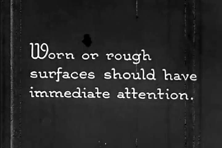 CIRCA 1930 - A construction crew repairs a road.