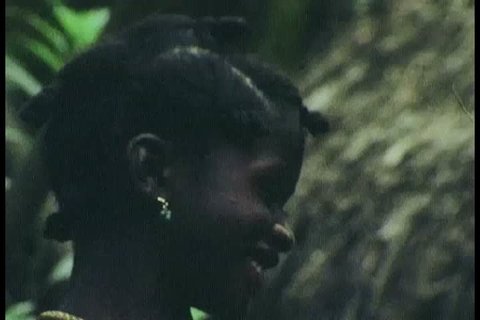 CIRCA 1970s - A family eats and children swim and an animation illustrates slavery and a plantation and a village is shown in Surinam.