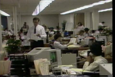 CIRCA 1980s - A Japanese chief executive officer is interviewed and IBM compatible personal computers are assembled.