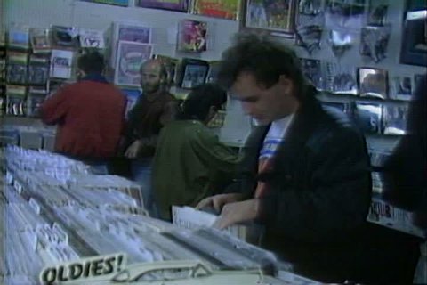 CIRCA 1980s - As customers shop for LPs, CDs and cassettes, a store owner talks about collectable albums.