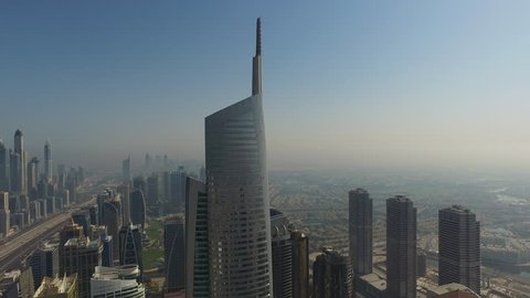Dubai, United Arab Emirates - January 5, 2019: Aerial drone view of Almas Tower skyscraper building in Jumeirah Lake multi Commodities Centre near Dubai Marina
