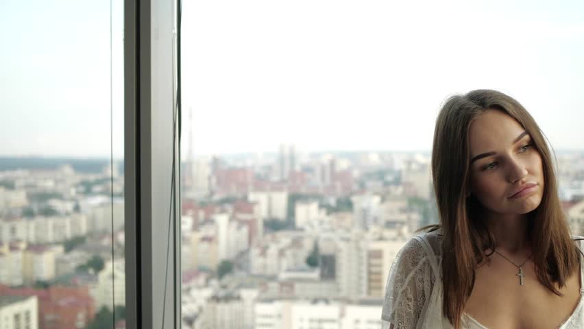 girl in lingerie posing near the window
