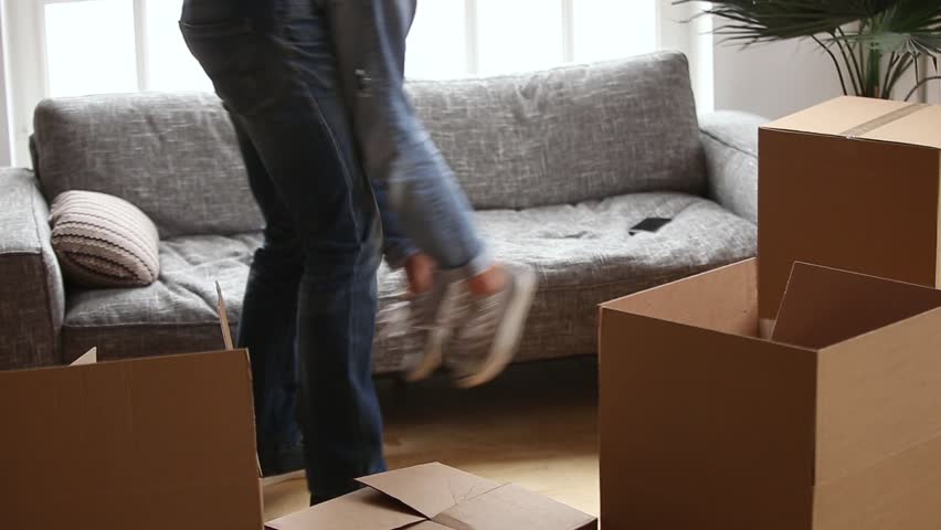 Happy couple first time buyers home owners embracing celebrating moving day, husband holding lifting wife among boxes after relocation into new flat, family goals, mortgage concept, close up view Royalty-Free Stock Footage #1022264155