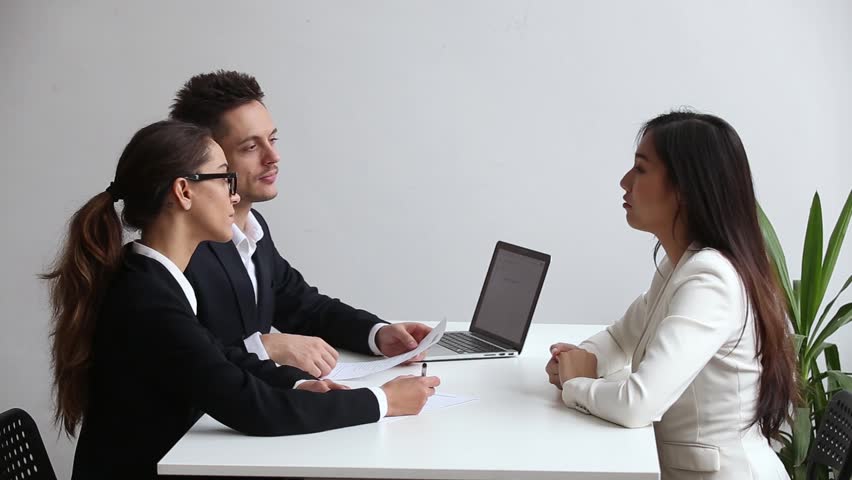 Professional caucasian hr manager handshaking asian applicant thanking for job interview making good first impression, recruiting staffing employers shaking hand hiring successful candidate concept Royalty-Free Stock Footage #1022264173