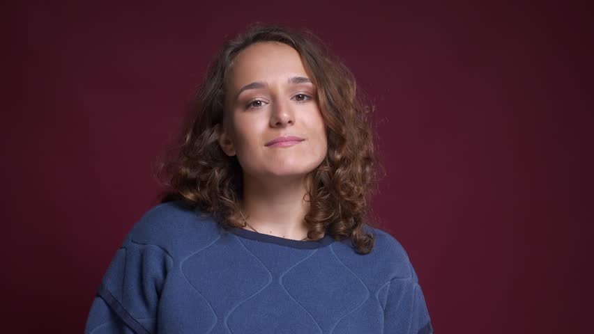 Closeup portrait of proud young caucasian female being satisfied smiling having her arms crossed over chest