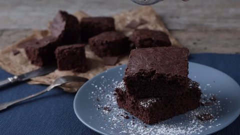 hd video- stack of brownies decorated with powdered sugar
