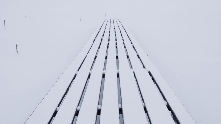 Snowy wooden bridge