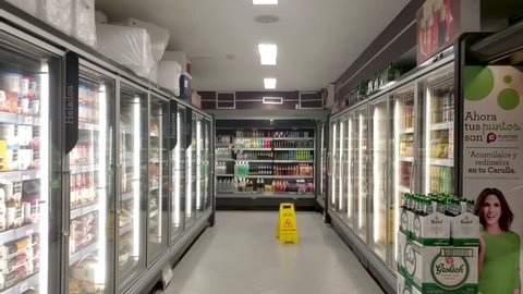 SANTA MARTA, COLOMBIA - NOVEMBER 2018: Smooth slow motion shot inside supermarket store (Refrigerated foods)