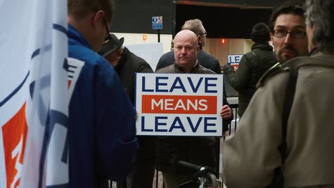 LONDON, circa 2019 - Close-up shot of Brexiteer campaigners showing propaganda messages in Westminster, London, England, UK advocating for a No-Deal BREXIT