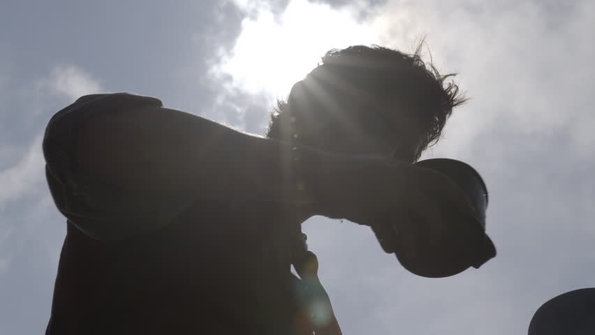 Man drinks water after digging and building railroad - mid-19th century. 1800s Western Transcontinental Railroad construction. Re-enactment recreation of California Gold Rush era. Laboring in the sun.