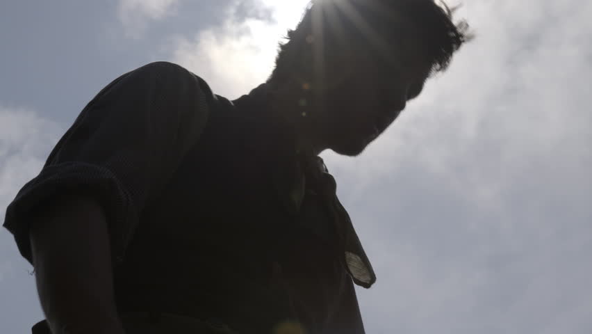 Man drinks water after digging and building railroad - mid-19th century. 1800s Western Transcontinental Railroad construction. Re-enactment recreation of California Gold Rush era. Laboring in the sun.