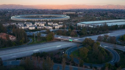 Aerial drone hyperlapse timelapse of the Apple Campus spaceship at sunset in Sunnyvale / Cupertino Silicon Valley, California. 01 January 2019