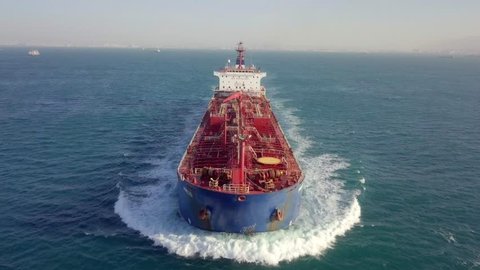 Mediterranean Sea - January 11, 2019: Large crude oil tanker roaring across The Mediterranean sea - Aerial footage following the ship.