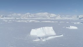 Iceberg Freeze Antarctica Ocean Water Aerial. Antarctic Winter Frozen Glacier Surface Majestic Landscape Overview. South Pole Peninsula Coast Drone Flight Footage Shot in 4K (UHD).