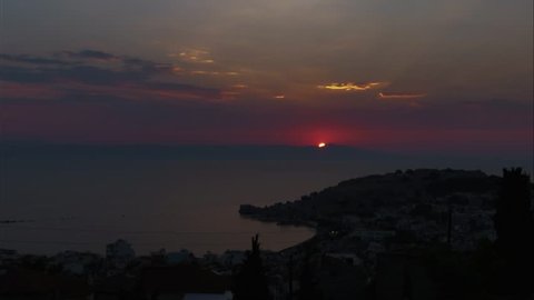 Beautiful sunrise time lapse looking over Turkish coast with Mytilene castle and old port in the foreground