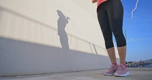 closeup slow motion of woman sport and rope skipping outdoor