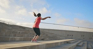 slow motion of woman sport and rope skipping outdoor